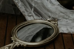 Veil with a mirror on wooden table