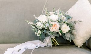 Wedding Bouquet with hand dyed silk ribbon on a velvet chair