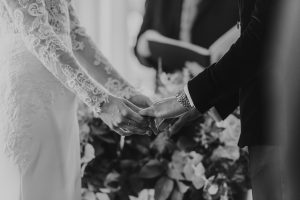 Bride & Groom holding hands during ceremony | Luxury Essex Wedding