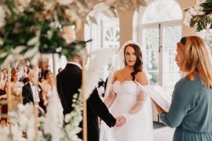 Bride & groom exchanging wedding vows | Luxury Essex wedding planner