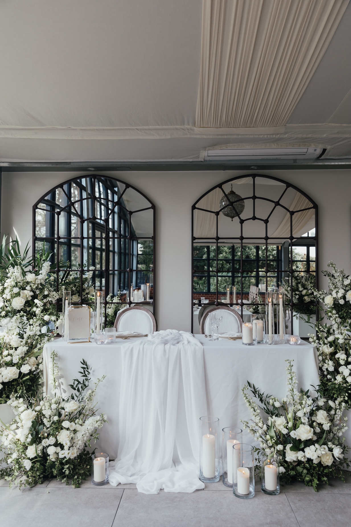 Beautifully Styled Sweetheart Table with Green & White Florals, Elegant Linen & Candles, Captured as Part of Hayley’s Calm & Professional Freelance Venue Coordination Support